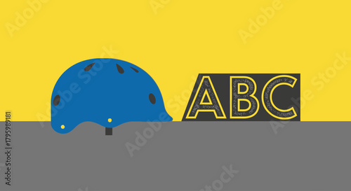 A blue helmet rests on a grey surface next to a black block with yellow 'ABC' letters, set against a bright yellow background in a flat graphic style.