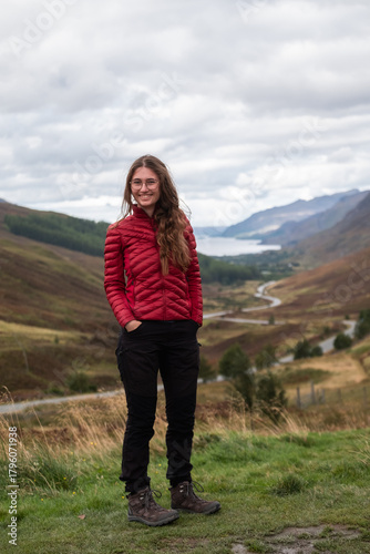 Smiling Blonde Woman in Hiking Outfit at Glen Docherty Viewpoint in the Scottish Highlands