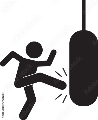 Man kicking a heavy punching bag in martial arts