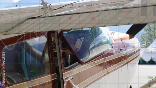 HUD overlays sliding over wing and glass after startup revealing readouts for preflight then fading