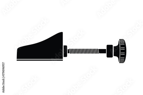 Black and white shoe stretcher. Footwear adjustment tool for shoes maintenance and stretching purposes.