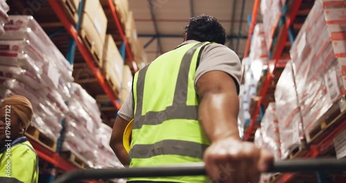 Trolley, handle and hand of logistics worker in warehouse for cargo, industrial or freight delivery. Distribution, pallet jack and male supply chain employee with inspection for shipping from below.
