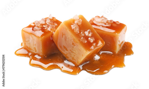 Schilderij op canvas Tasty candies with salt and caramel sauce isolated on white