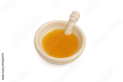 Honey in ceramic bowl with dipper transparent background