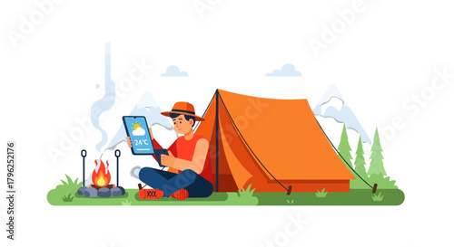 Digital Nomad Enjoying Weather Readings Beside Campsite Fire in the Mountains