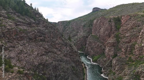 Drone flight through a canyon over the Gunnison River below in the high country of Colorado