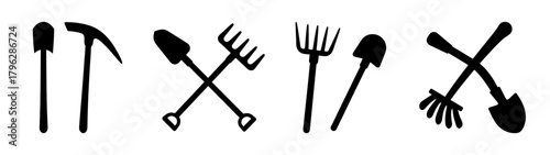 Collection of agricultural tools including shovels picks and rakes for farming