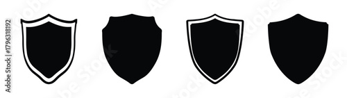 Collection of four diverse black shield icons representing protection security defense and safety