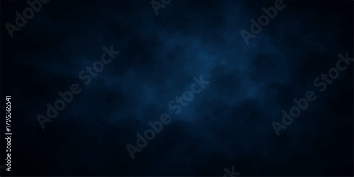 Dark blue smoke texture in motion on a black background