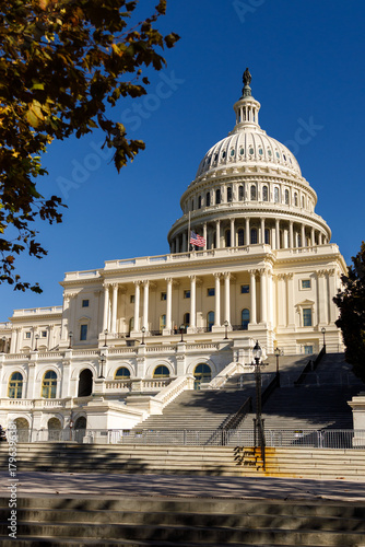 A sunny autumn day in Washington, DC. The White House stands amid autumn trees. The US government  shut down. Memorial Day in capital of USA.