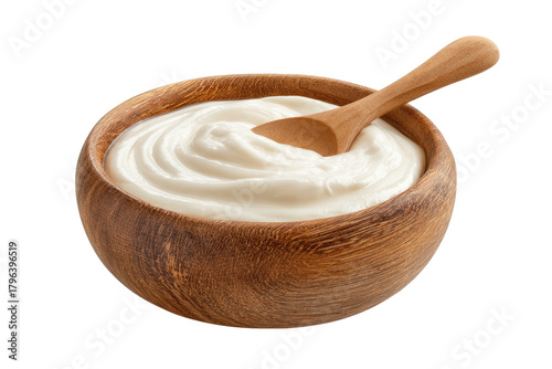 Creamy yogurt in wooden bowl with spoon, isolated on black background