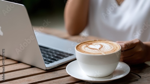Enjoying a warm cup of coffee while working remotely at home close-up view of a cozy setup for comfort and productivity