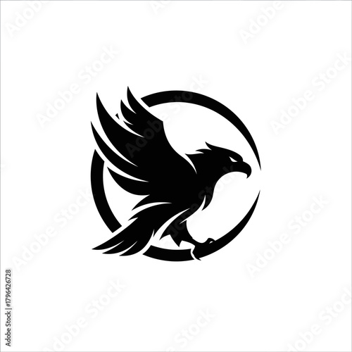 Black silhouette of a majestic eagle or hawk with wings spread, flying within a circular emblem, symbolizing strength and freedom.