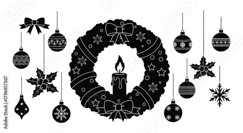 Silhouette of a christmas wreath with a lit candle and hanging ornaments and decorations