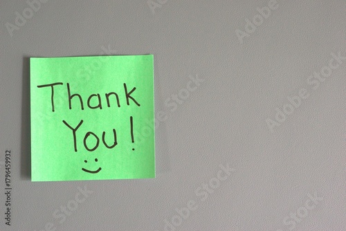 green sticky note with 