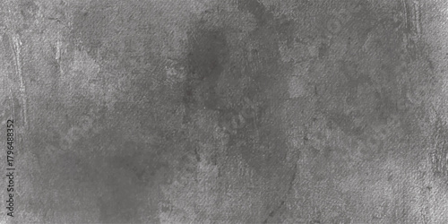 A close up view of a heavily textured gray concrete wall showcasing a rough and aged surface with subtle tonal variations