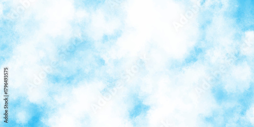 A serene and expansive view of a bright blue sky filled with soft fluffy white clouds creating a peaceful atmosphere