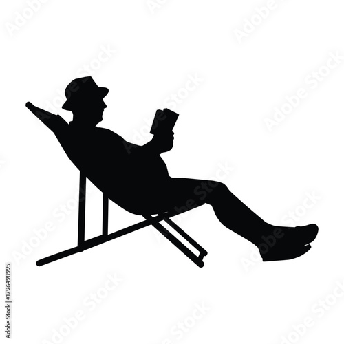 Silhouette of a man wearing a hat, comfortably sitting back in a deck chair and reading a book or magazine. The image symbolizes relaxation, holiday, reading hobby, and peaceful leisure time.