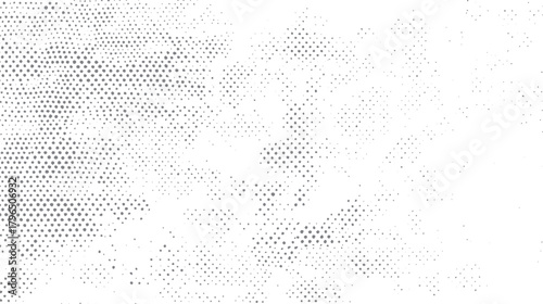 Abstract grey dots pattern scattered across a white background with varying density and size circle
