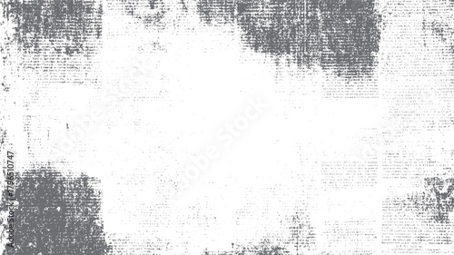 Faded grey textured overlay of newspaper print with scattered dots and smudges on white background grunge