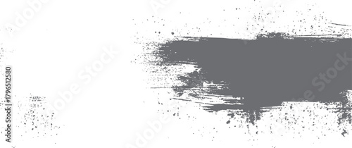Textured grey brush stroke with scattered ink splatters on white background abstract graphic black chaos