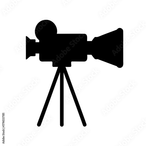 Vintage movie camera silhouette on tripod stand, a retro film icon