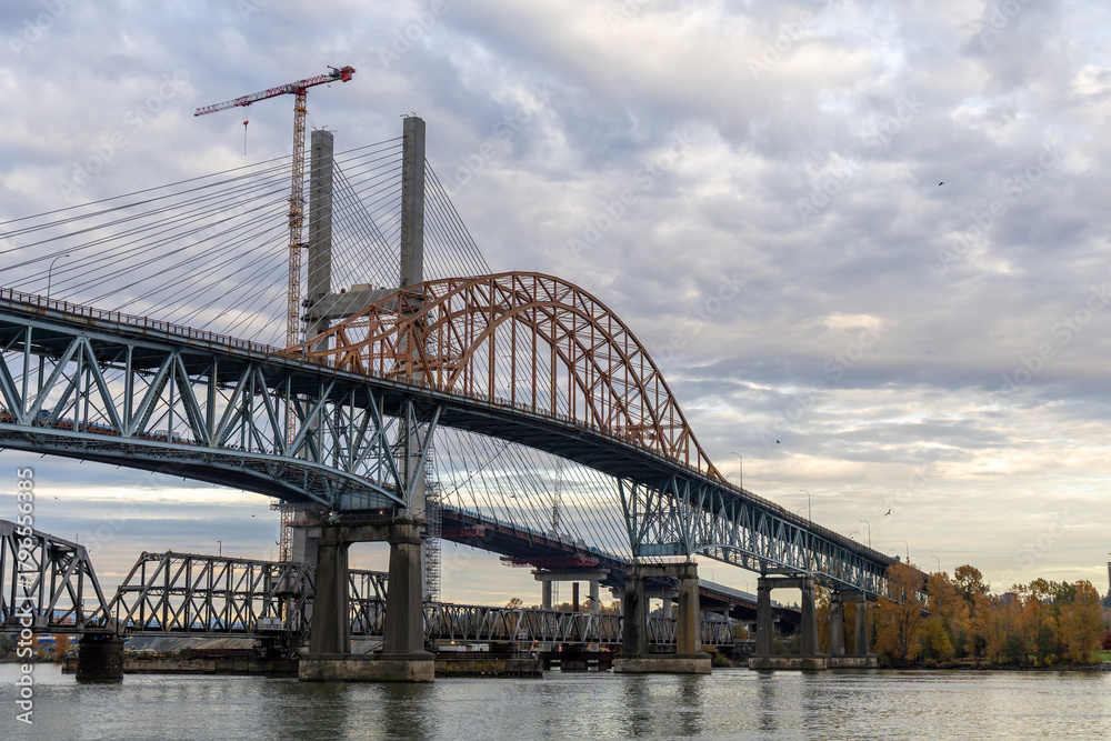 Obraz premium New Westminster Bridge Under Construction With Crane Over River in Greater Vancouver, BC, Canada—Scenic View