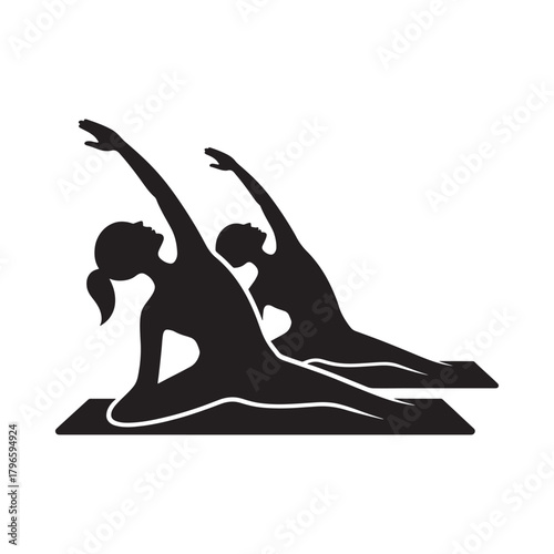 Silhouettes of two women practicing yoga side bend pose