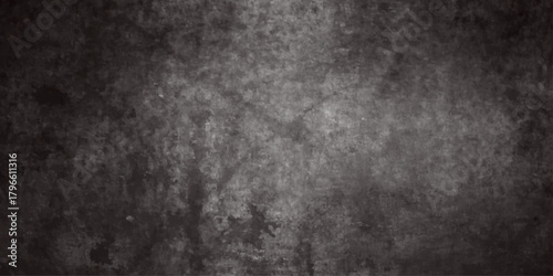 A dark textured background showcases a mottled gray surface with subtle variations in tone and a grainy appearance
