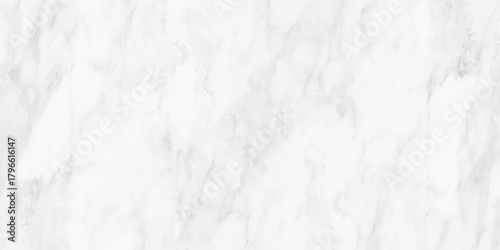 A detailed closeup of a white marble surface displays striking veining and subtle texture variations