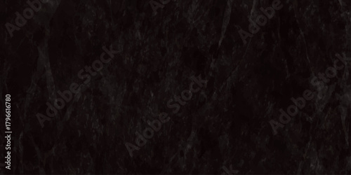 An extremely dark textured background displaying a predominantly black slightly blurred and grainy surface high quality