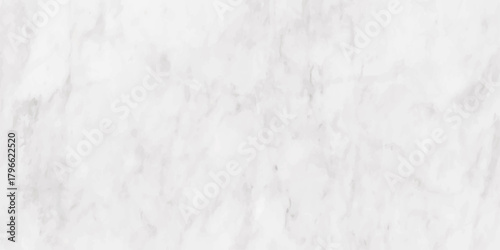 A detailed close up view of a white marble surface with subtle grey veining and texture