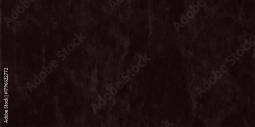 A close up view of a dark textured background resembling fine tangled fibers or strands of deep brown material