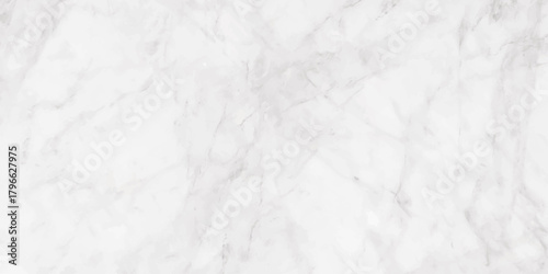A detailed full frame view of a white marble texture with subtle gray veins and patterns throughout