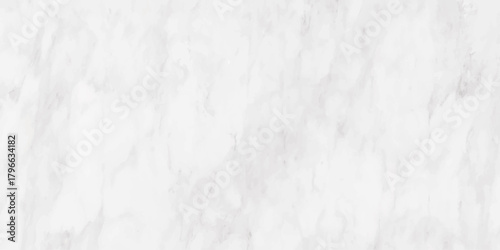 A detailed close up view of a white marble surface with subtle gray veining throughout the stone texture