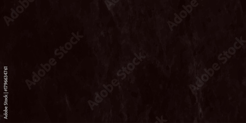 A dark nearly black image displaying a textured surface with subtle vertical lines and a grainy appearance