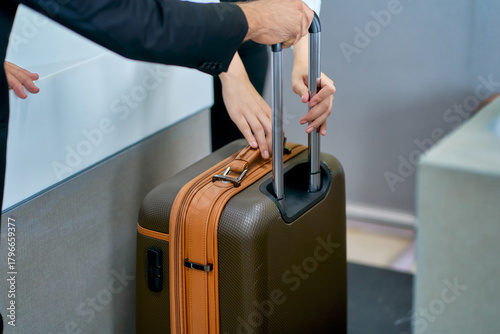 Scene of passenger's lagguage check weight for check in procedure in airport counter.