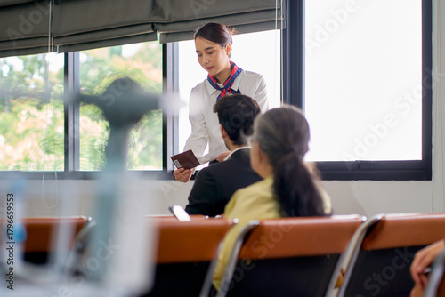 Airport atmosphere local with air ground staff help passengers for advide passport to check in and travel by the airplane.