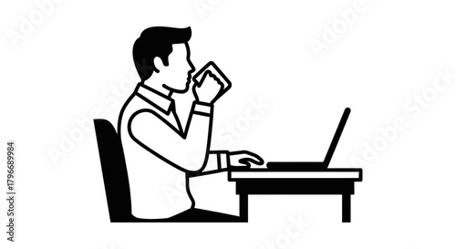 Man working on a laptop computer while drinking from a mug.