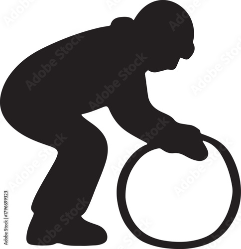 Person Holding a Hoop Ready to Roll Downhill