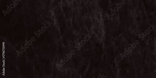 High resolution texture of a very dark nearly black slate or marble stone surface It features subtle veining and a rugged, weathered.
