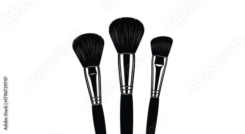 Three black makeup brushes with silver ferrules on a white background.
