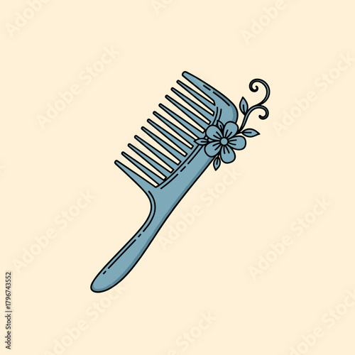 A delicate blue comb adorned with a charming floral embellishment and leafy vines is displayed against a soft peach background, creating an elegant aesthetic.