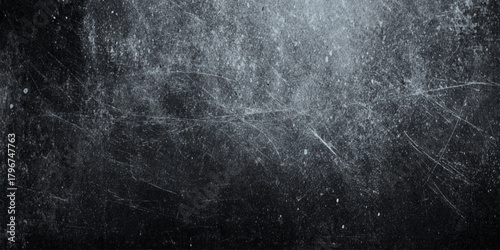 Black and white grunge texture plaster wall with scratched distressed overlay, dark vintage noise background for design.	