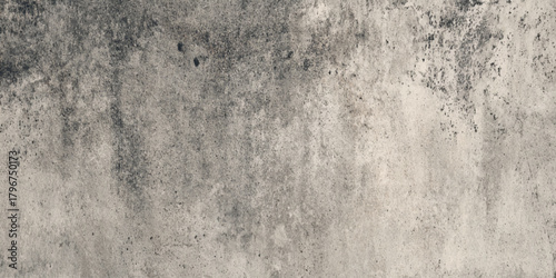 Abstract distressed vintage plaster wall background for overlay featuring authentic scratches and subtle stains on a black to gray gradient background.	