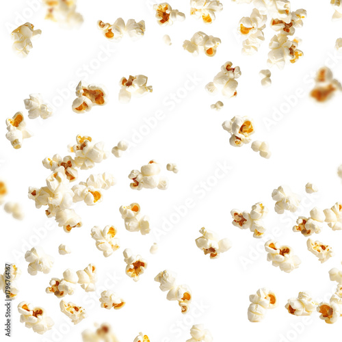 Scattered crispy popcorn falling motion on a bright white backdrop
