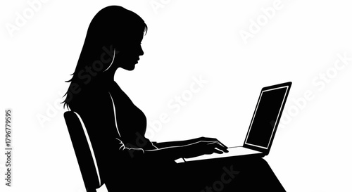 Silhouette of a woman working on a laptop, focused and determined.