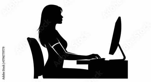 Silhouette of a woman sitting at a desk using a computer.