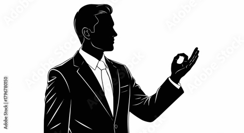 Silhouette of a businessman making an OK gesture.