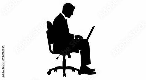 Silhouette of a businessman working on a laptop computer while sitting on an office chair.